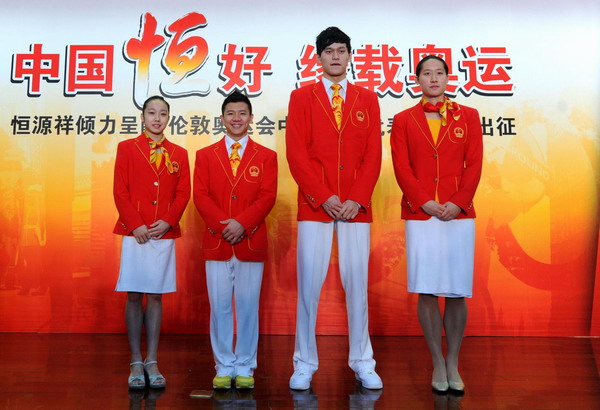 Chinese athletes Huang Qiu, left, Chen Yibing, Sun Yang and Liu Zige show off their uniforms for the London Olympics at an unveiling ceremony in Beijing, June 25, 2012. China unveils uniforms for Olympic team