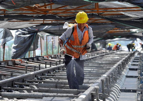 Work proceeds on the Lanzhou-Urumqi high-speed railway, the longest such rail link under construction in the world. Yao Tong / for China Daily Challenging times on 'high-speed Silk Road'