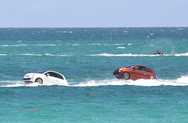 Fiat cars swimming off coast