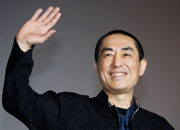 Chinese director Zhang Yimou waves as he poses for the media during a news conference for his opening film 'Under the Hawthorn Tree' at the 15th Pusan International Film Festival in Busan, about 420 km (261 miles) southeast of Seoul, in this October 7, 2010 file photo. China to grill Zhang Yimou's agent