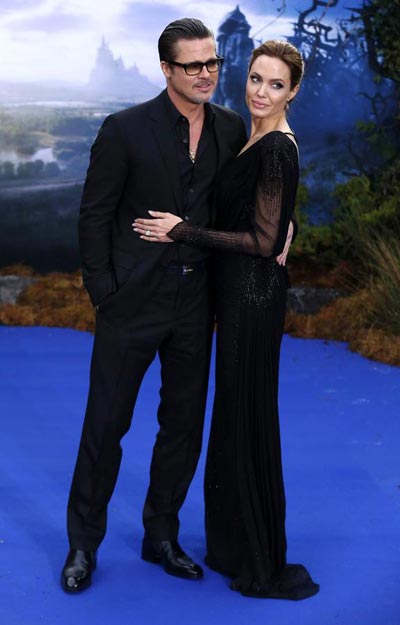 Quietly, Brad Pitt and Angelina Jolie say, 'I do'