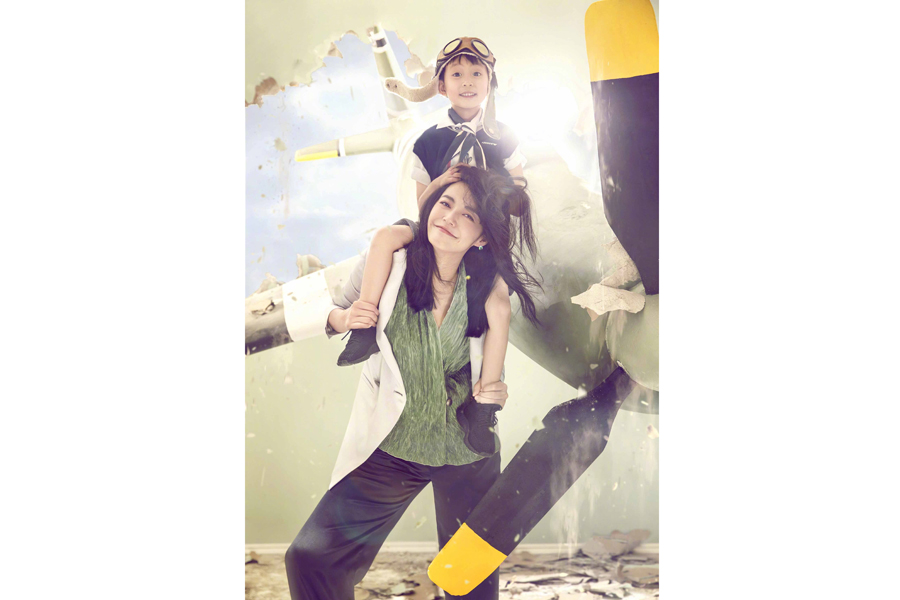 Actress Yao Chen and her son pose for fashion magazine