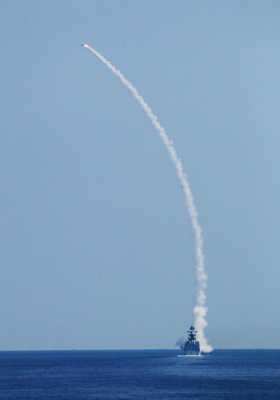 A missile frigate launches a ship-to-air missile to intercept an enemy target on Sept 5, 2012.  Proud decade for China's Army