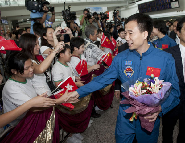 Chinese astronaut Jing Haipeng arrives at Hong Kong International Airport on Friday. Shenzhou IX astronauts share feelings with HK media