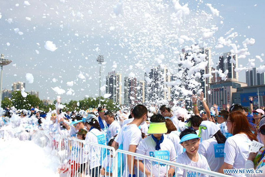 People attend Bubble Run activity in Shenyang