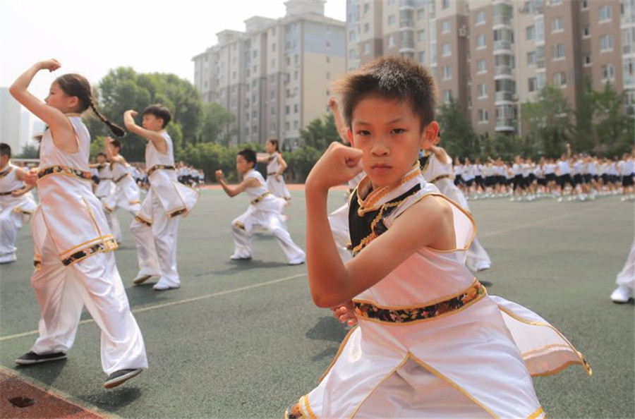 Students practice martial arts during class break