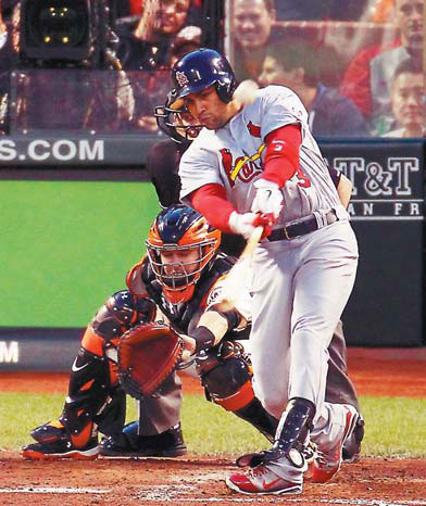 Cardinals dump Giants 6-4 in series opener