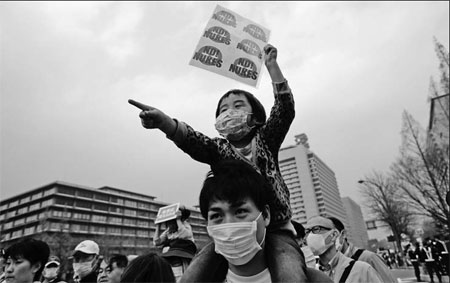 Anti-nuclear protesters march two years after Fukushima