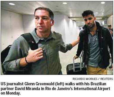 Britain defends decision to detain reporter's partner