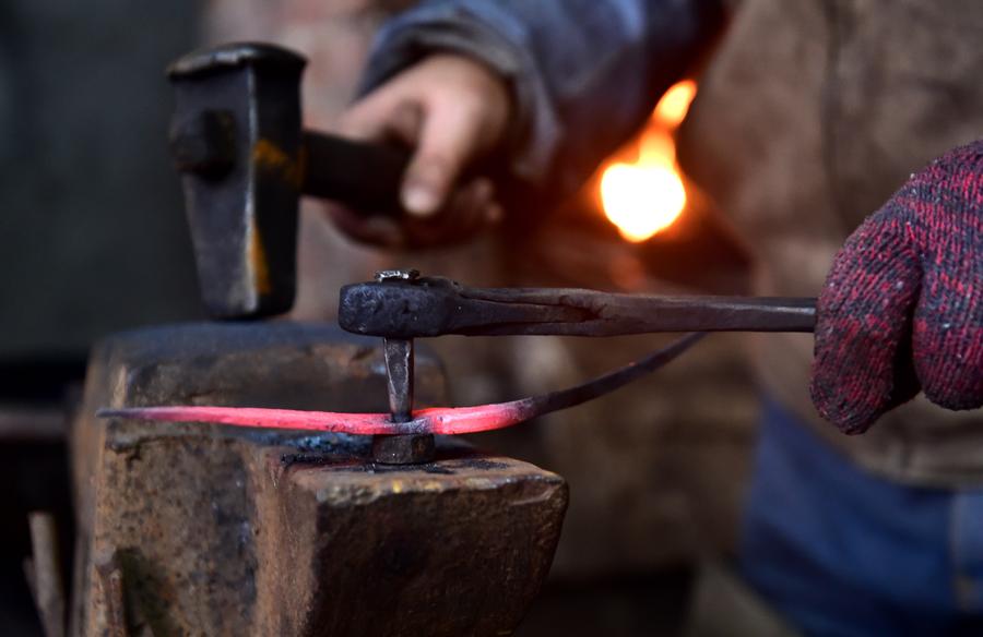 Craftsman makes scissors in traditional way