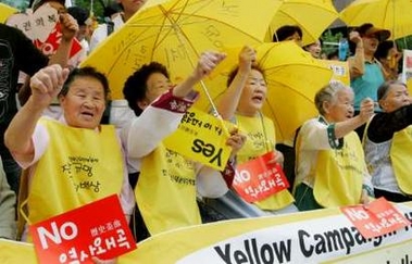South Korean women who said they were forced to become sex slaves by the Japanese military during World War Two shout slogans at an anti-Japan rally against Japanese Prime Minister Junichiro Koizumi's visit to South Korea in front of the Japanese embassy in Seoul June 15, 2005. 