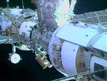 Space station astronauts take spacewalk