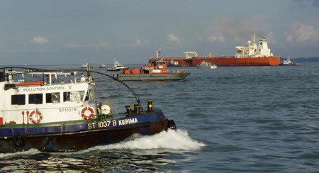 Oil spills off Singapore after tanker collision
