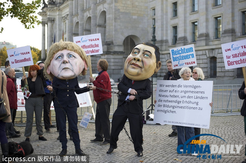 德民眾棄默克爾與社民黨主席“頭顱” 抗議兩黨聯(lián)合執(zhí)政