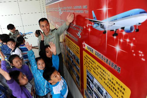 Children celebrate coming holiday at airport