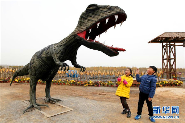 Shandong farmers make cartoon characters out of used tires