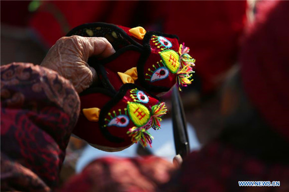 Shoemaker, 85, sews ‘tiger’ wish for children