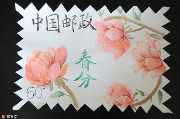 Student paints spring scenes on stamps