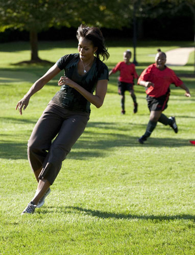 First Lady Michelle Obama hosts a 'Let's Move!' clinic with members of the US women's soccer team to teach kids soccer skills and highlight the importance of physical activity on the South Lawn of the White House in Washington October 6, 2011. US first lady shows off soccer skills at WH