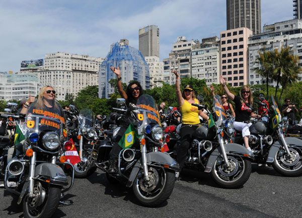 Harley-Davidson fans take part in a parade as the first festival held for the motorcycle enthusiasts in Rio de Janeiro, Brazil comes to a close, Nov 6, 2011. The festival started on Nov 4. Harley fans roar to the sound of samba in Brazil