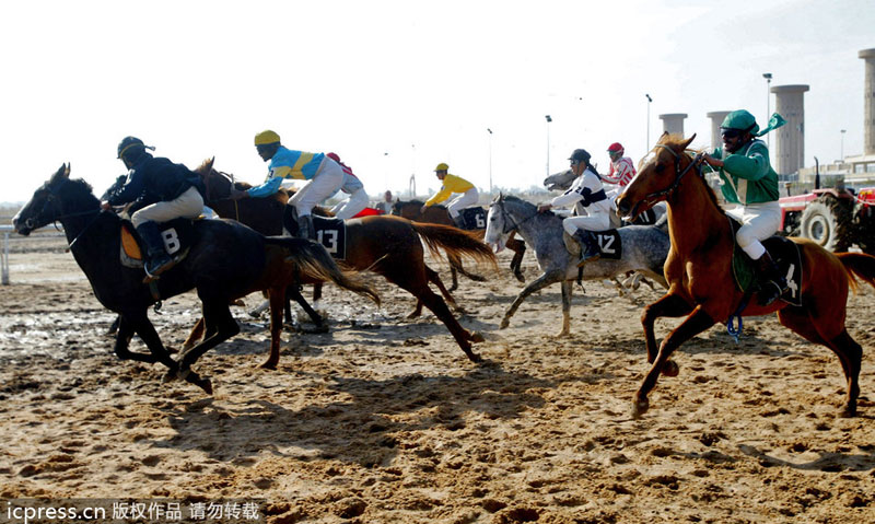 Iraqi jockeys race at a racing course in Baghdad's restive neighborhood of al-Ghazaliya, on Jan 16. 2007. Public sports in post-war Iraq