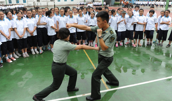 New girls get a lesson in combat