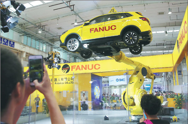 Beijing-developed robots rock at world conference