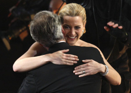 Kate Winslet holds her Oscar for best actress at Oscars