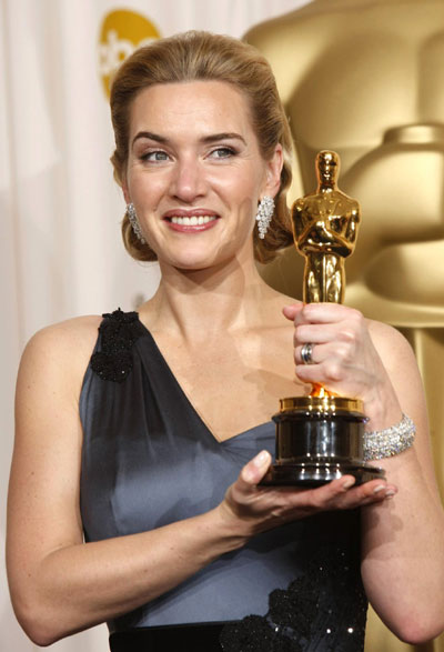 Kate Winslet holds her Oscar for best actress at Oscars