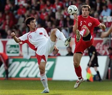 Switzerland's Xavier Margairaz, right and China's Zheng Zhi, left, fight for the ball, during a test match between the national soccer teams of Switzerland and China, in Zurich, Switzerland, Saturday, June 3, 2006, ahead of the World Cup in Gemany. Switzerland will play in group G with France, Togo and South Korea. China is not qualified for the World Cup.