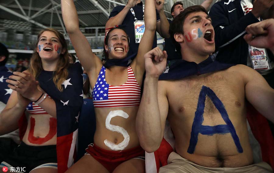 Fans with face paint celebrate Olympics