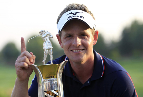 Luke Donald was on top of the world in more ways than one on Sunday after becoming the first player to win the money-list crowns in Europe and the United States, when he made three birdies in his last three holes at the Dubai World Championship to win the European Tour's Race to Dubai. Wealthy in any language