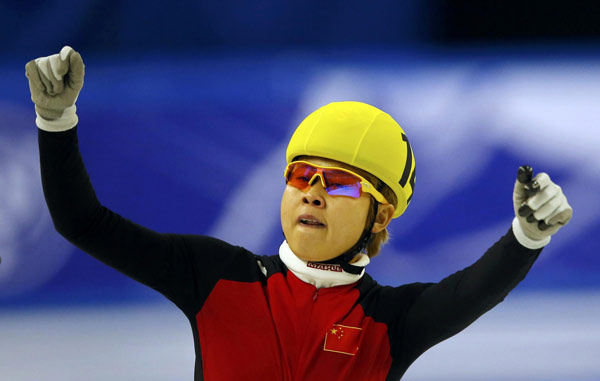 Wang Meng of China celebrates as she won the women's 1000m final at the ISU World Short Track Speed Skating Championships in Debrecen March 10, 2013. Wang Meng wins 1000m at short-track speedskating worlds