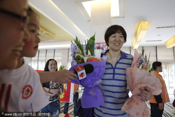 Lang Ping and the Chinese national women's volleyball team arrive at the Ningbo Lishe International Airport for the 2013 China International Women's Volleyball Tournament in Beilun, Ningbo city, Zhejiang province, May 14, 2013. Lang Ping and national team arrive in Ningbo for Beilun tournament