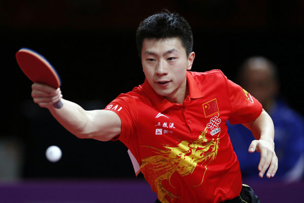 China's Ma Long plays against Soumyajit Ghosh of India in their men's singles opening round match at the World Team Table Tennis Championships in Paris, May 15, 2013. Chinese stars all advance at table tennis worlds