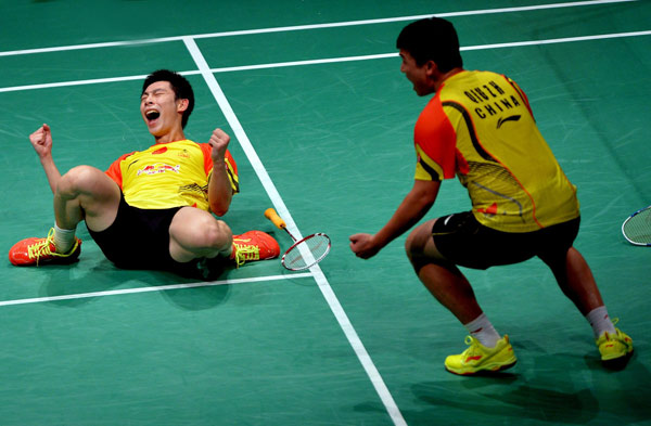 China's Liu Xiaolong (L) with partner Qiu Zihan celebrate after winning against South Korea's Ko Sung-hyun and Lee Yong-dae during their men's doubles match at the finals of the Sudirman Cup World Team Badminton Championships in Kuala Lumpur May 26, 2013. China won the Sudirman Cup 2013. China defends Sudirman Cup with victory against S. Korea