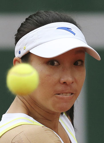 Zheng Jie of China eyes the ball during her women's singles match against Melanie Oudin of the US at the French Open tennis tournament at the Roland Garros stadium in Paris, May 30, 2013. Zheng Jie the only hope in Roland Garros