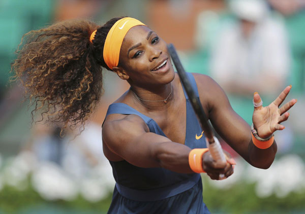 Serena Williams of the US hits a return to Sara Errani of Italy during their women's singles semi-final match at the French Open tennis tournament at the Roland Garros stadium in Paris, June 6, 2013. Serena mauls Errani, Sharapova awaits in final
