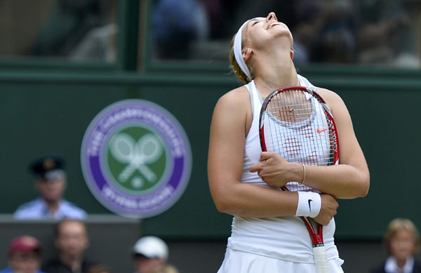 Sabine Lisicki of Germany reacts during her women's singles tennis match against Serena Williams of the US at the Wimbledon Tennis Championships, in London, July 1, 2013. Lisicki stuns Serena in another Wimbledon shock