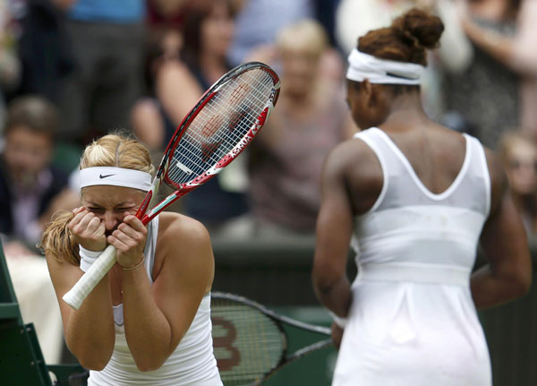 Sabine Lisicki of Germany (L) celebrates after defeating Serena Williams of the US (R) during their women's singles tennis match at the Wimbledon Tennis Championships, in London, July 1, 2013. Lisicki stuns Serena in another Wimbledon shock