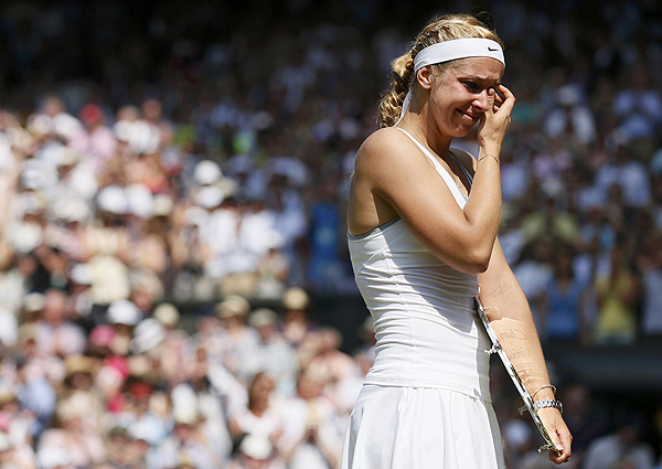 Sabine Lisicki of Germany cries as she is interviewed on Centre Court, after receiving her runners-up trophy, after being defeated by Marion Bartoli of France in their women's singles final tennis match at the Wimbledon Tennis Championships, in London on July 6, 2013. Bartoli sinks tearful Lisicki to win Wimbledon