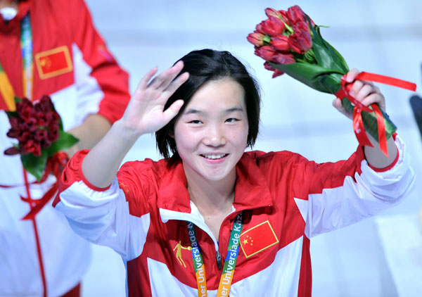 Zheng Shuangxue of China celebrates after winning the women's 3-meter springboard title at the Kazan Universiade in Kazan, Russia, July 10, 2013. Chinese divers back to winning track at Universiade