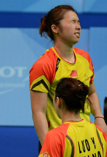 China's Olympic champion Tian Qin, top, and Luo Yu react during their women's badminton doubles final against South Korea at the Kazan Universiade in Kazan, Russia, July 12, 2013. South Korea biggest winner in Universiade badminton