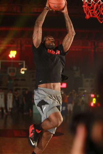 NBA star LeBron James shows off his basketball skills during a visit to Beijing's Imperial Taimiao Temple to encourage young people to exercise, on July 27, 2013. LeBron James promotes youth sports in Beijing