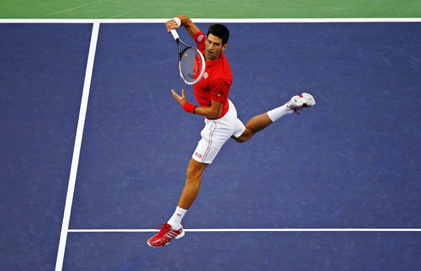 Novak Djokovic of Serbia returns the ball during the men's singles final match against Juan Martin Del Potro of Argentina at the Shanghai Masters tennis tournament October 13, 2013. Djokovic retains Shanghai Masters title