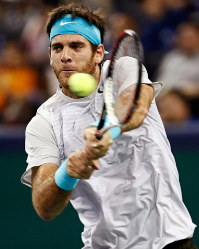 Juan Martin Del Potro of Argentina returns the ball during the men's singles final match against Novak Djokovic of Serbia at the Shanghai Masters tennis tournament October 13, 2013. Djokovic retains Shanghai Masters title