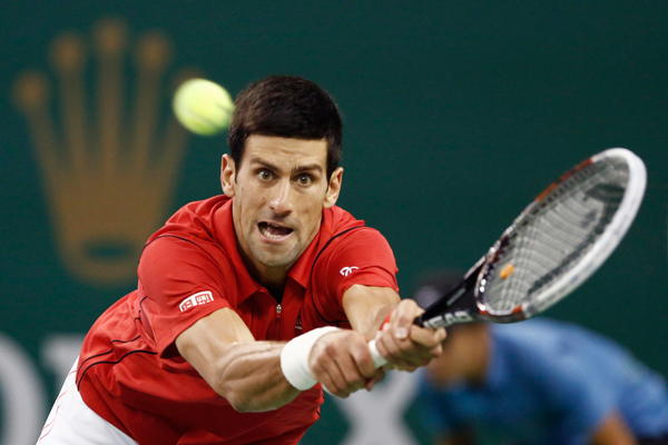 Novak Djokovic of Serbia hits a shot during the men's singles final match against Juan Martin Del Potro of Argentina at the Shanghai Masters tennis tournament October 13, 2013. Djokovic retains Shanghai Masters title