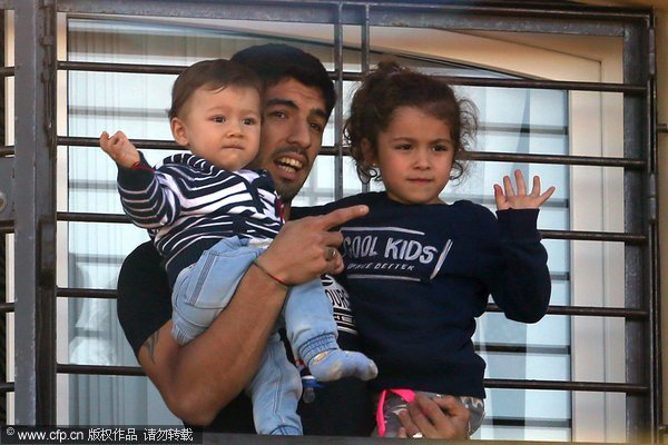 Luis Suarez receives a hero's welcome at home