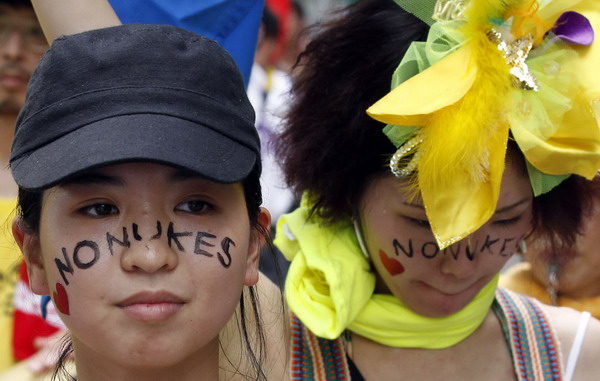 Protesters bearing anti-nuclear face-painting take part in an anti-nuclear march in Hiroshima August 6, 2011. Japan's Hiroshima city marks atomic bombing