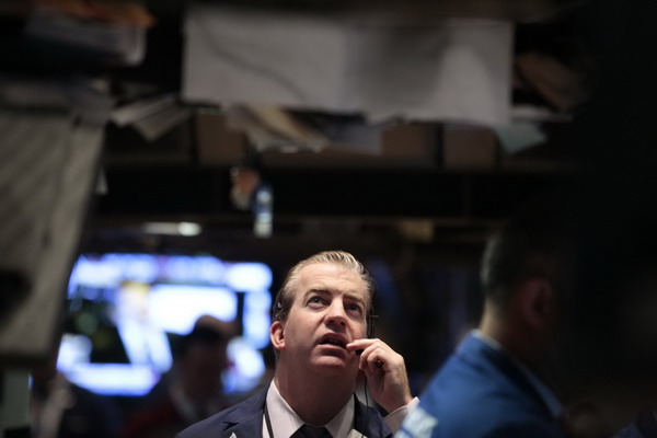 A trader works on the floor of the New York Stock Exchange Sept 22, 2011. Warnings mount on euro crisis, BRICS mull more aid